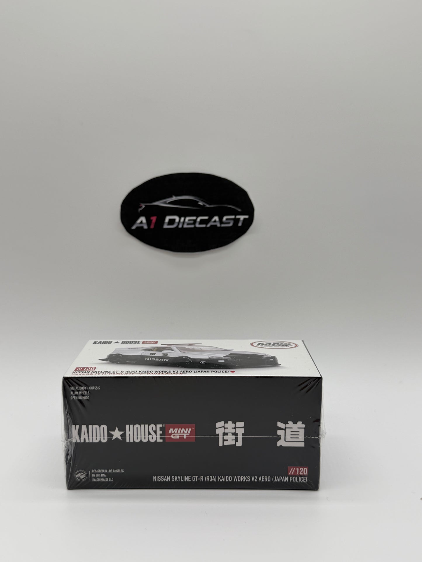 Kaido House Mini GT Nissan Skyline GT-R (R34) Kaido Works V2 Aero (Japan Police)