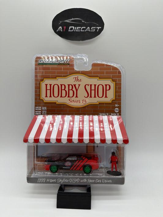 Greenlight The Hobby Shop 1999 Nissan Skyline R34 with Race Car Driver Chase